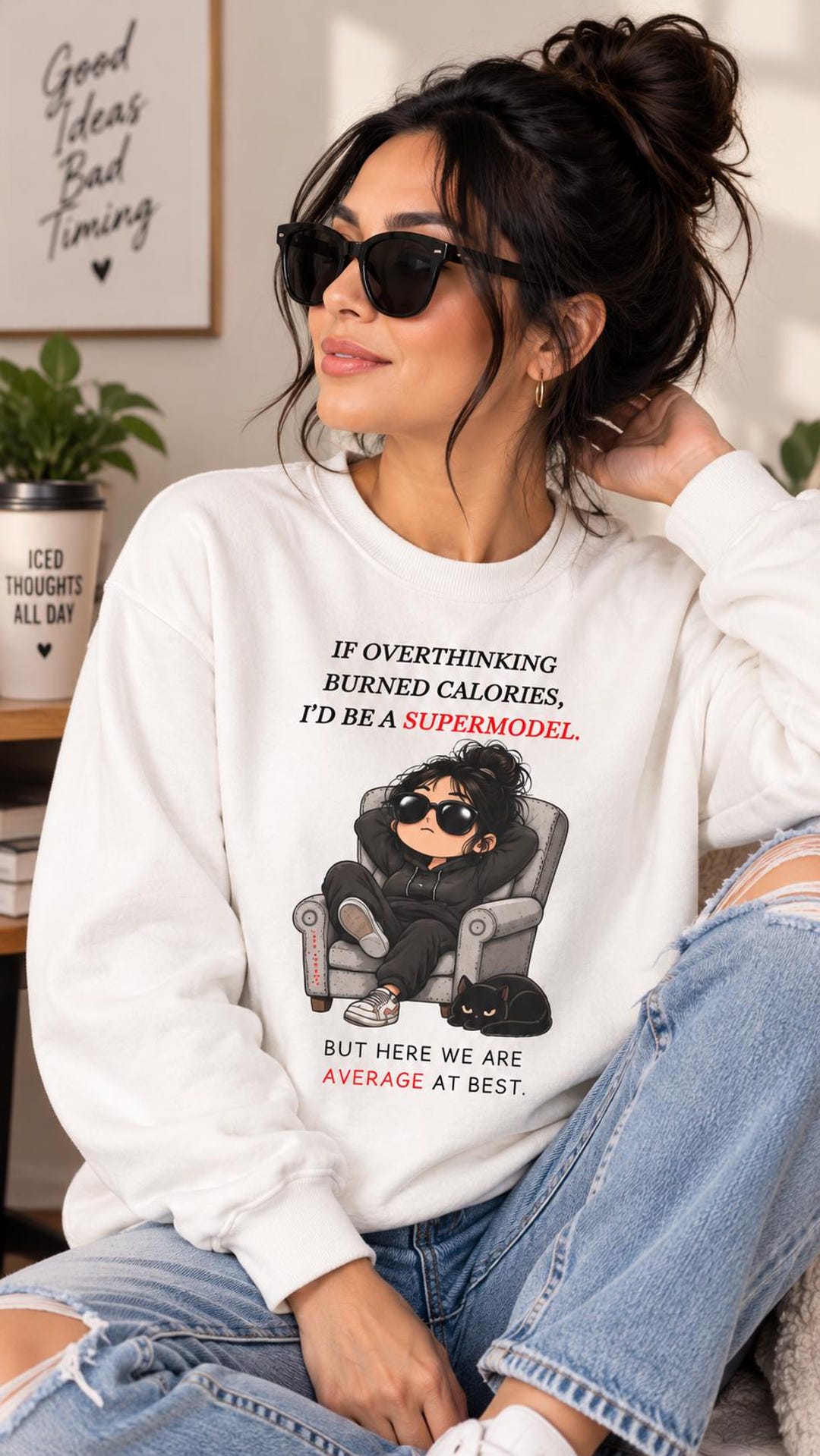 White sweatshirt with an overthinking supermodel quote and a seated cartoon character